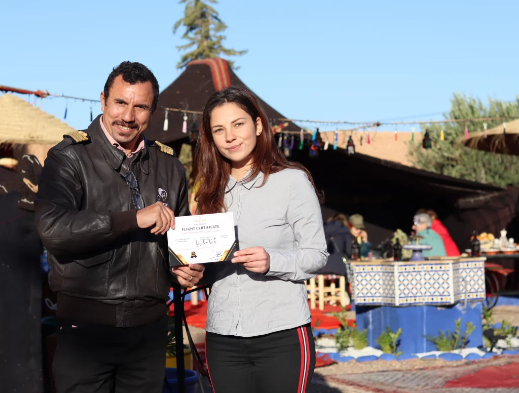 A passenger with her hot air balloon certificate